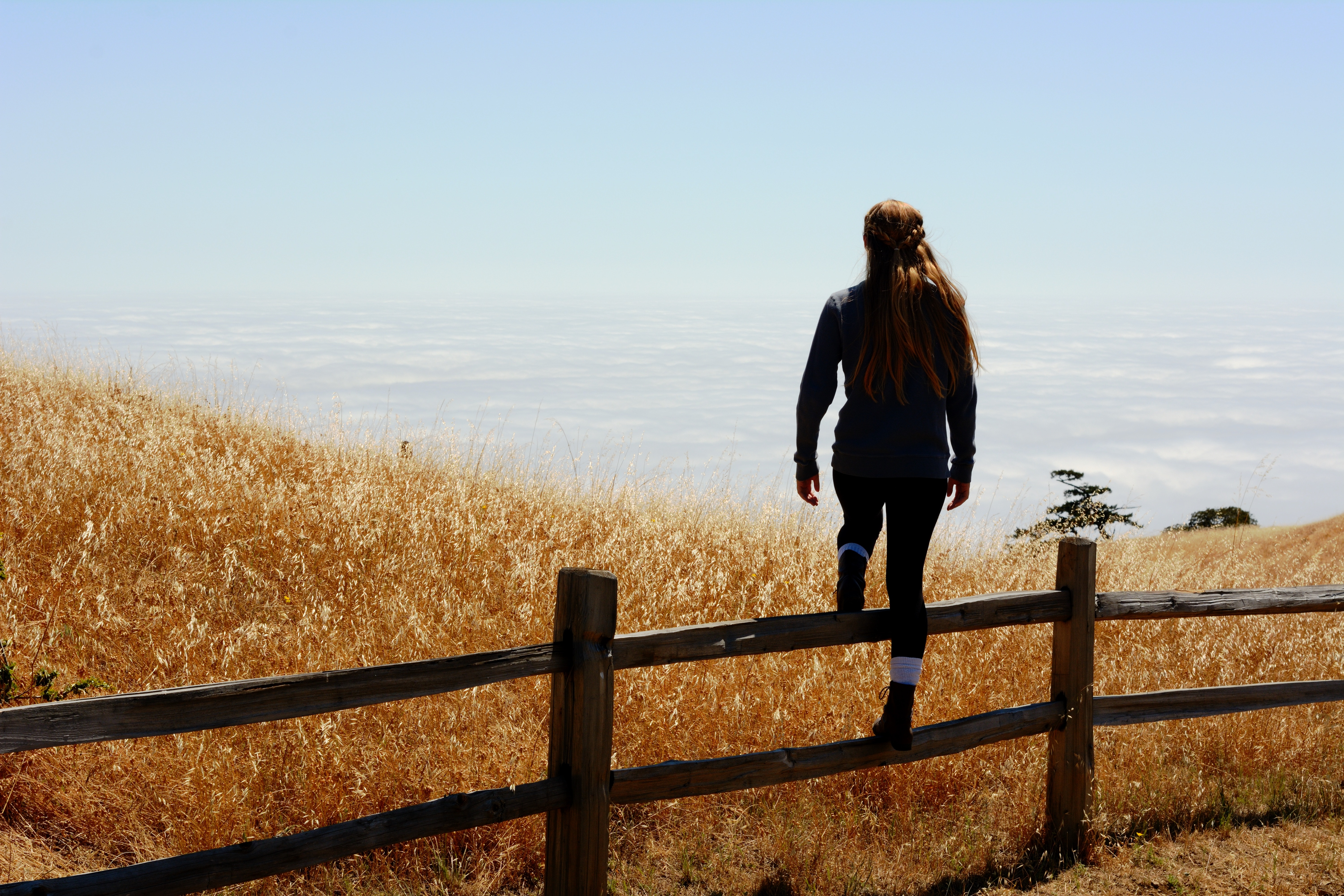 michael-rosner-hyman-30557-unsplash woman jump on brown fence